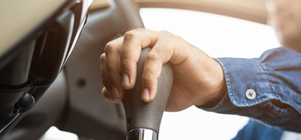 Person holding a gear stick