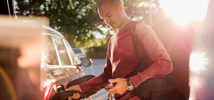 Man filling up his car with Mobil