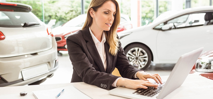 A Mobil employee working on her laptop