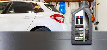 Mobil 1 0W-20 on a bench banner